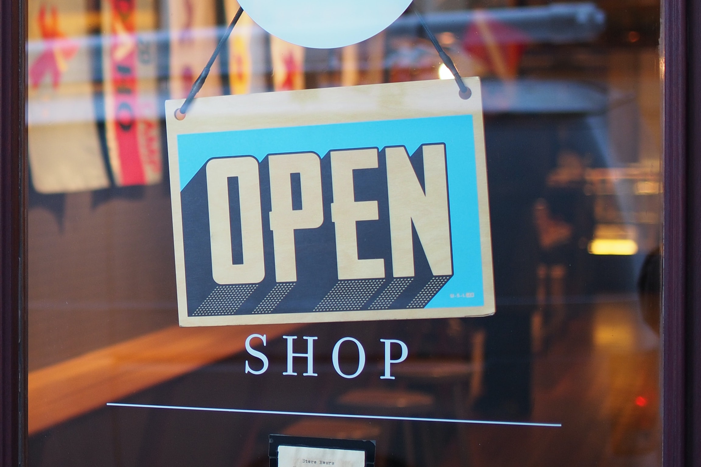 Open sign on business door.